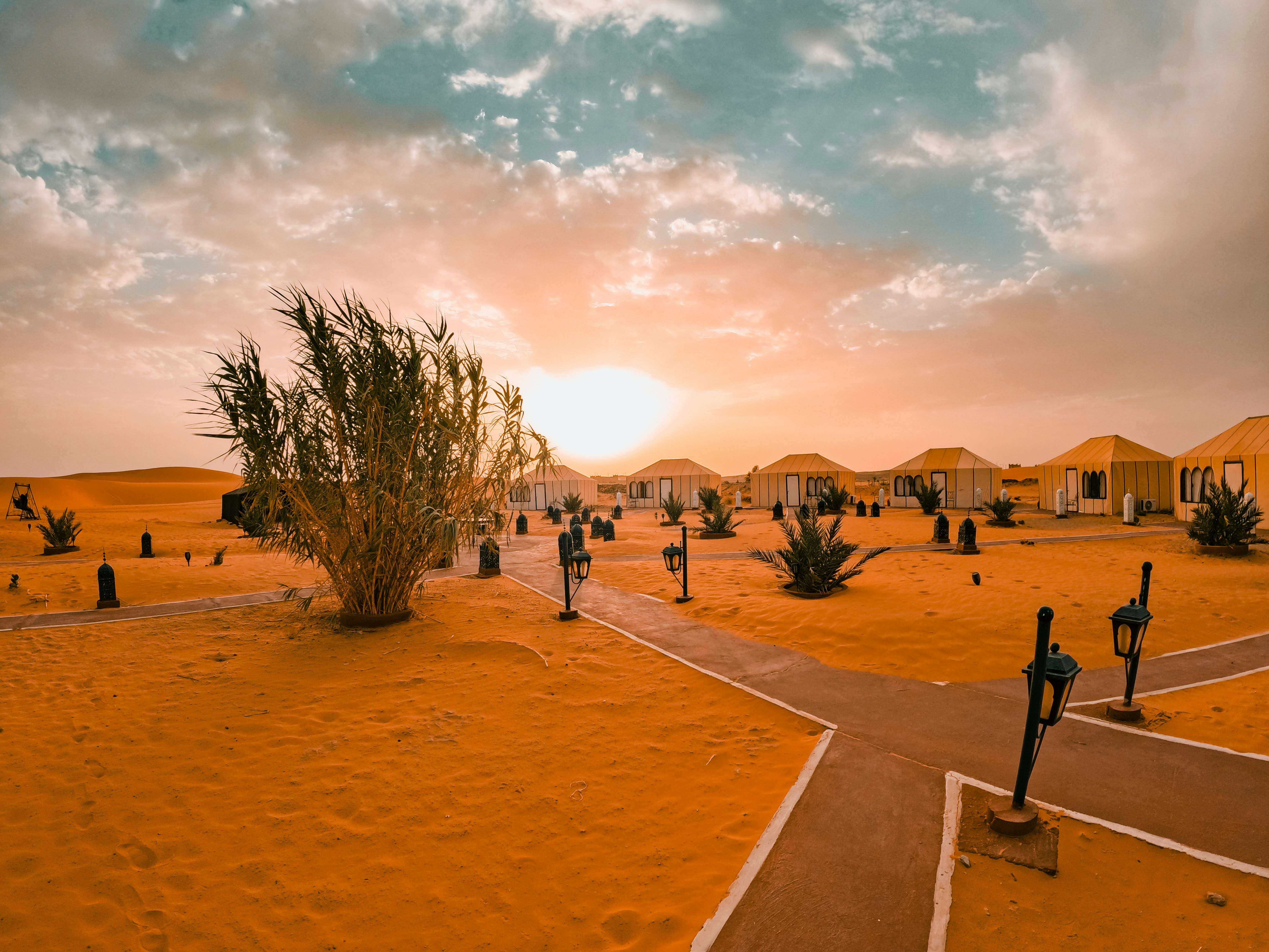 What are the typical costs for a night in a luxury desert camp?